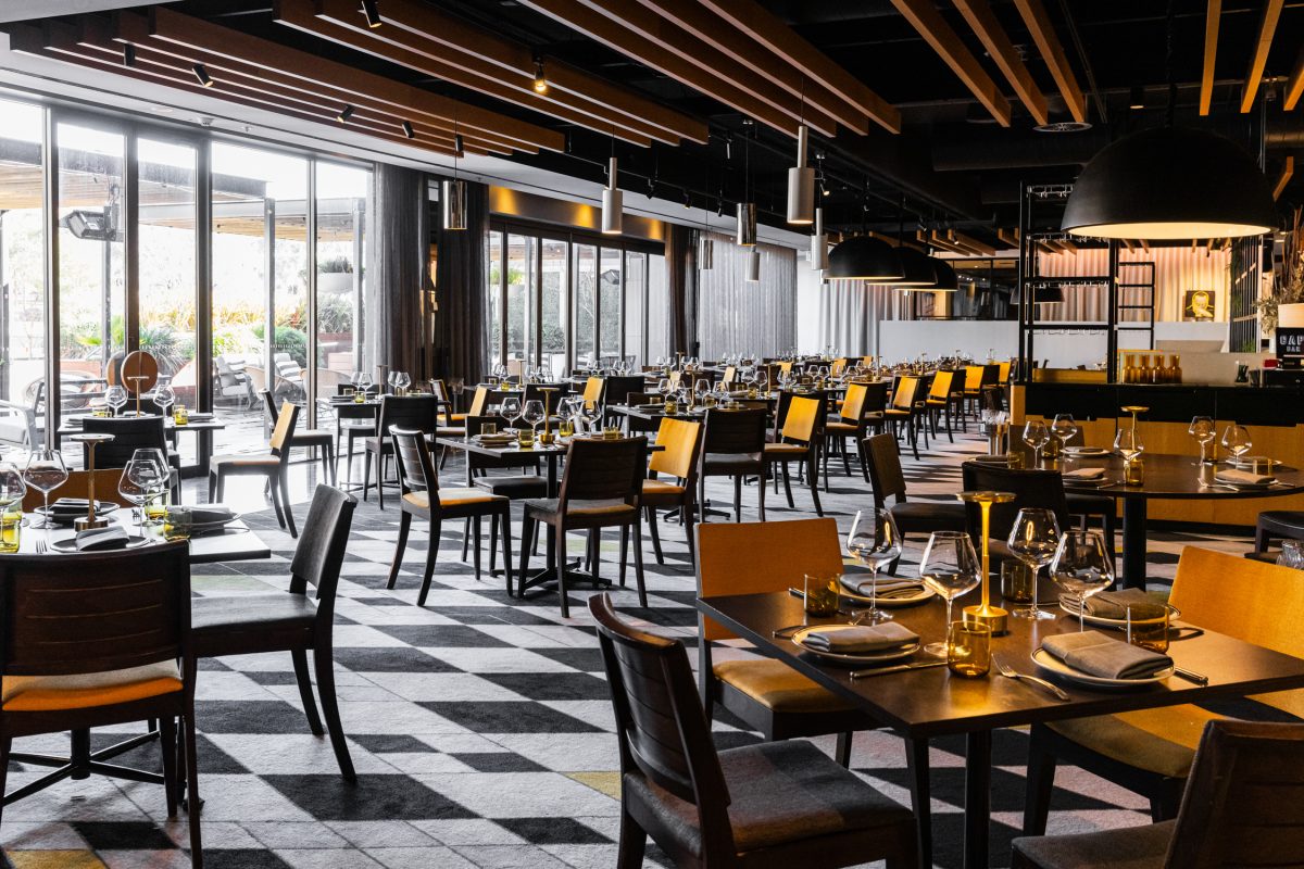 A restaurant with black and white tiled floor.