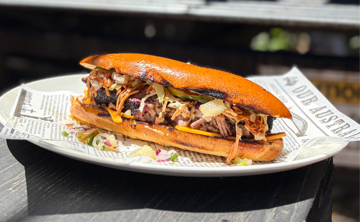 Roll with smoked meat and coleslaw on a plate