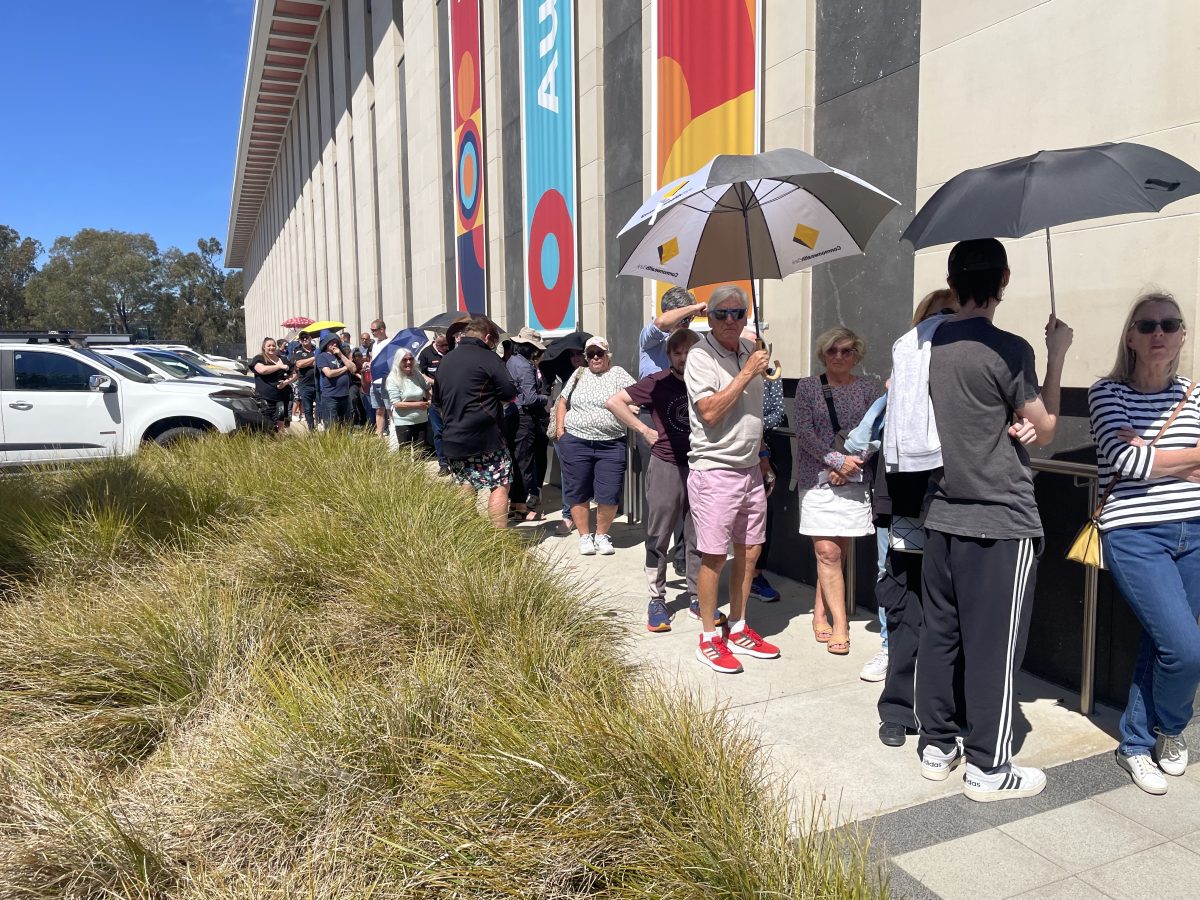 Image of people waiting in line outside of the Royal Australian Mint.
