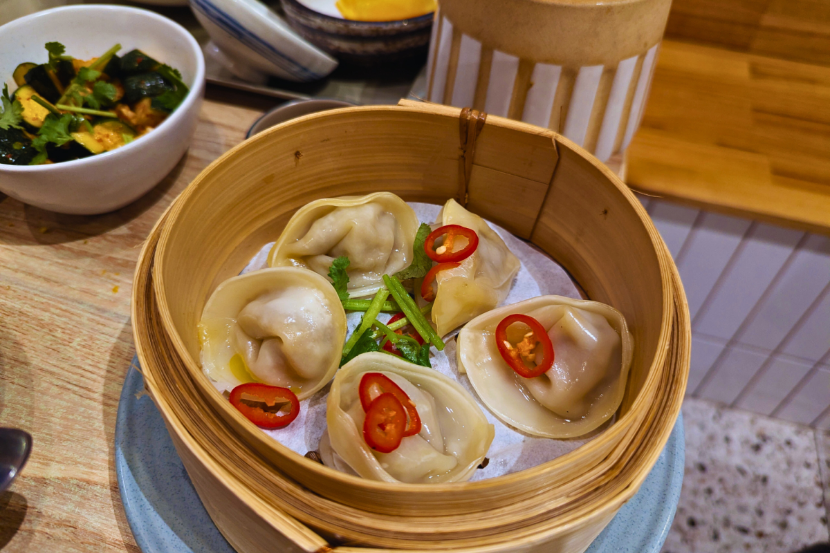 A steamer basket of dumplings.