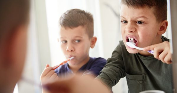 Parents, ending the toothbrush tug-of-war isn’t easy (but it's really important)