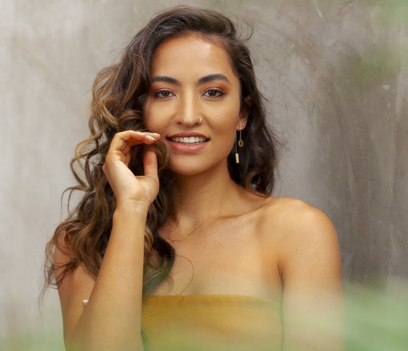 Woman smiles at camera.