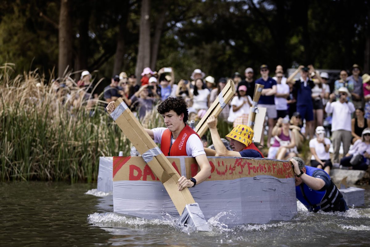 Achieving the impossible; rowing in a cardboard boat at the Golden Oar regatta. Photo: Supplied.