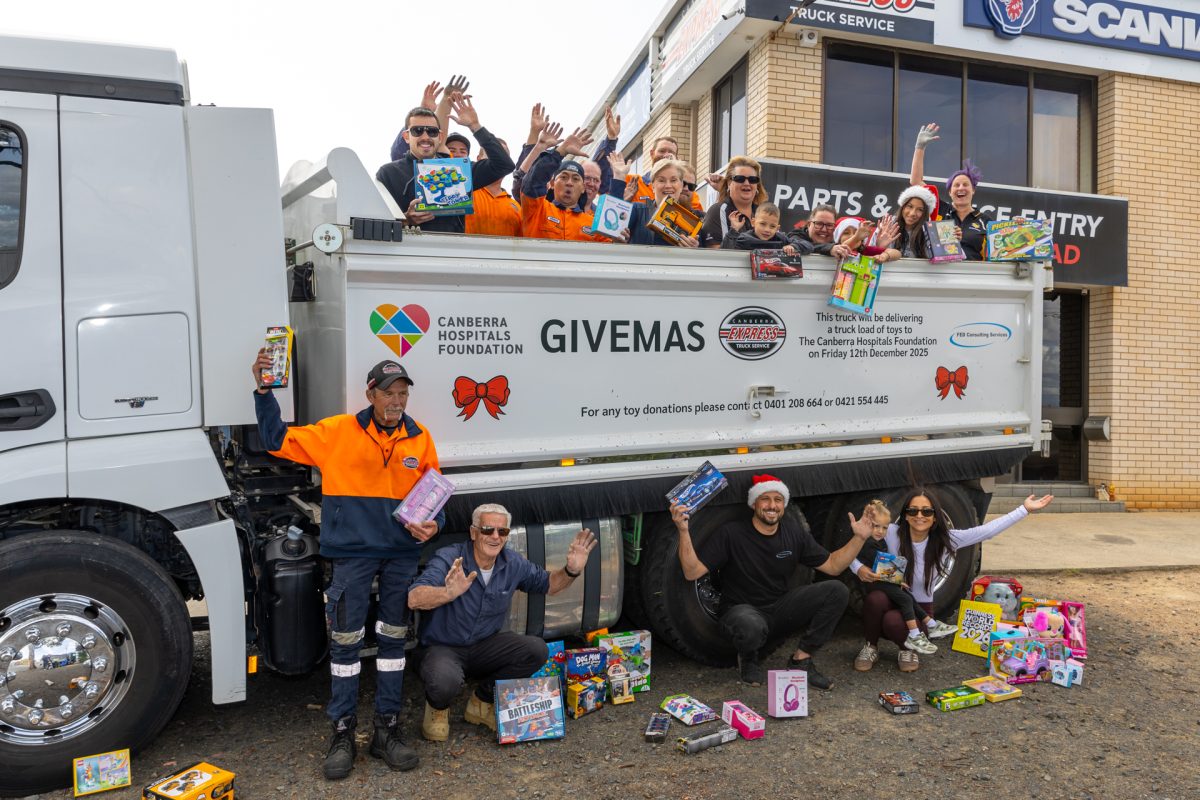 group of people with a tipper truck