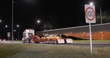 Enormous steel girders rumble into Canberra as first light-rail bridge takes shape