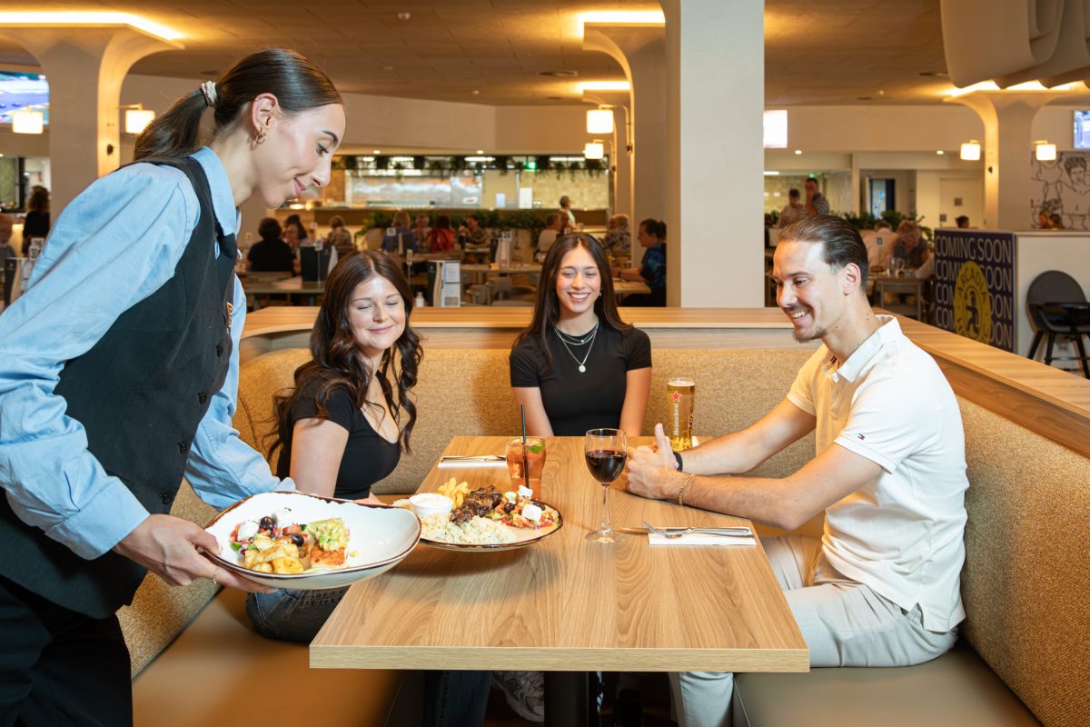 person serving meals in a bistro