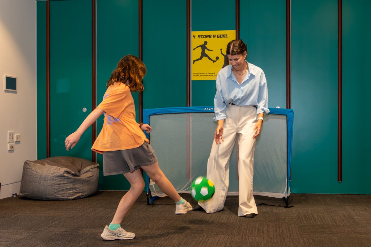 two people playing indoor soccer