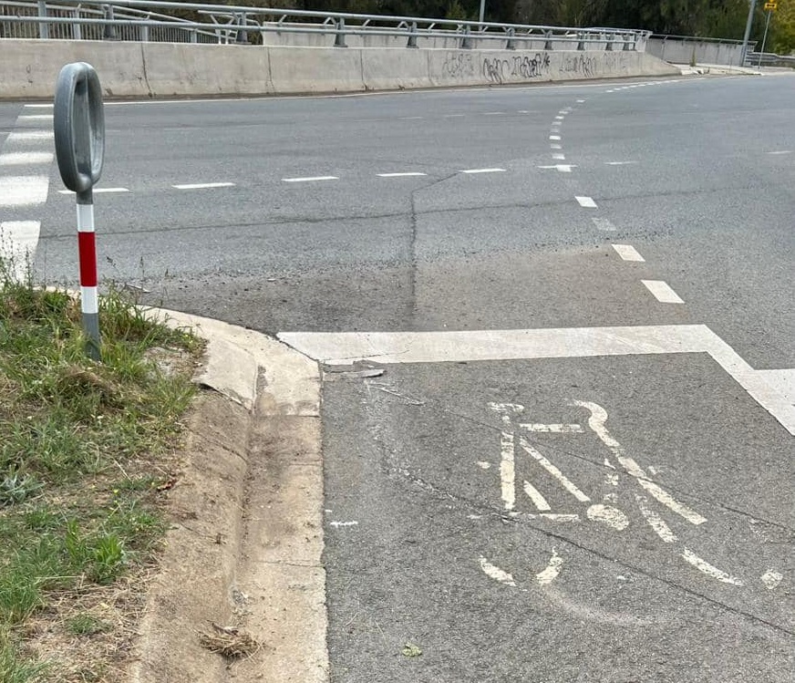 faded paint designating a bike lane