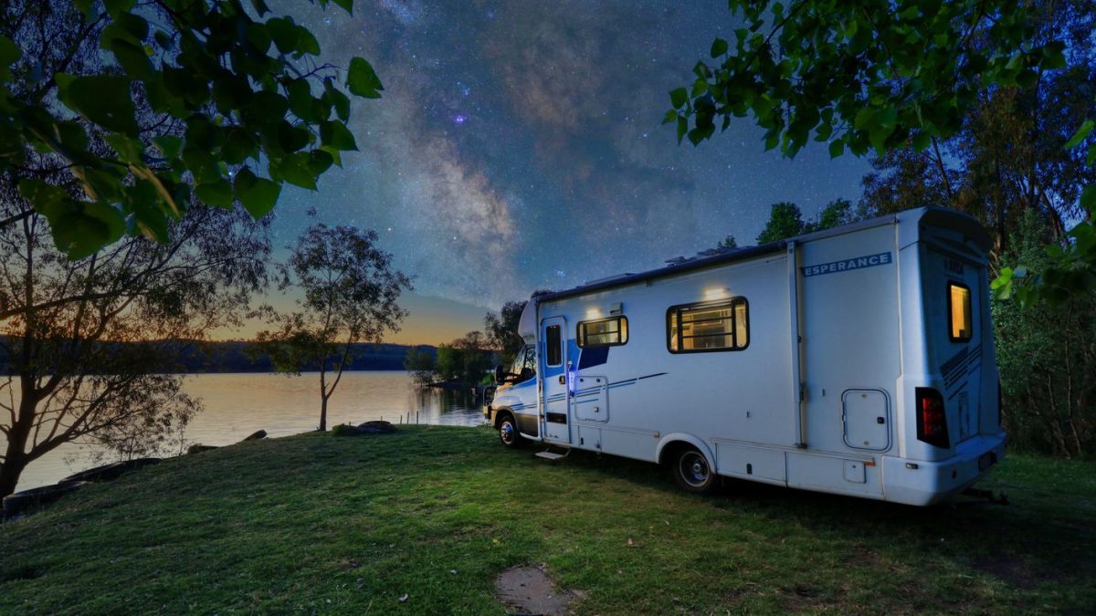 caravan parked under starry skies on the shores of Lake Burrinjuck