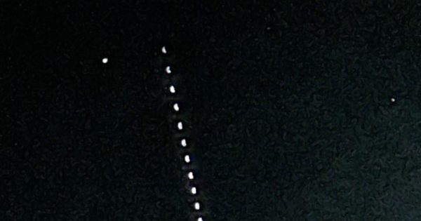 Behold the 'space centipede': Weird series of lights spotted over Canberra's night sky