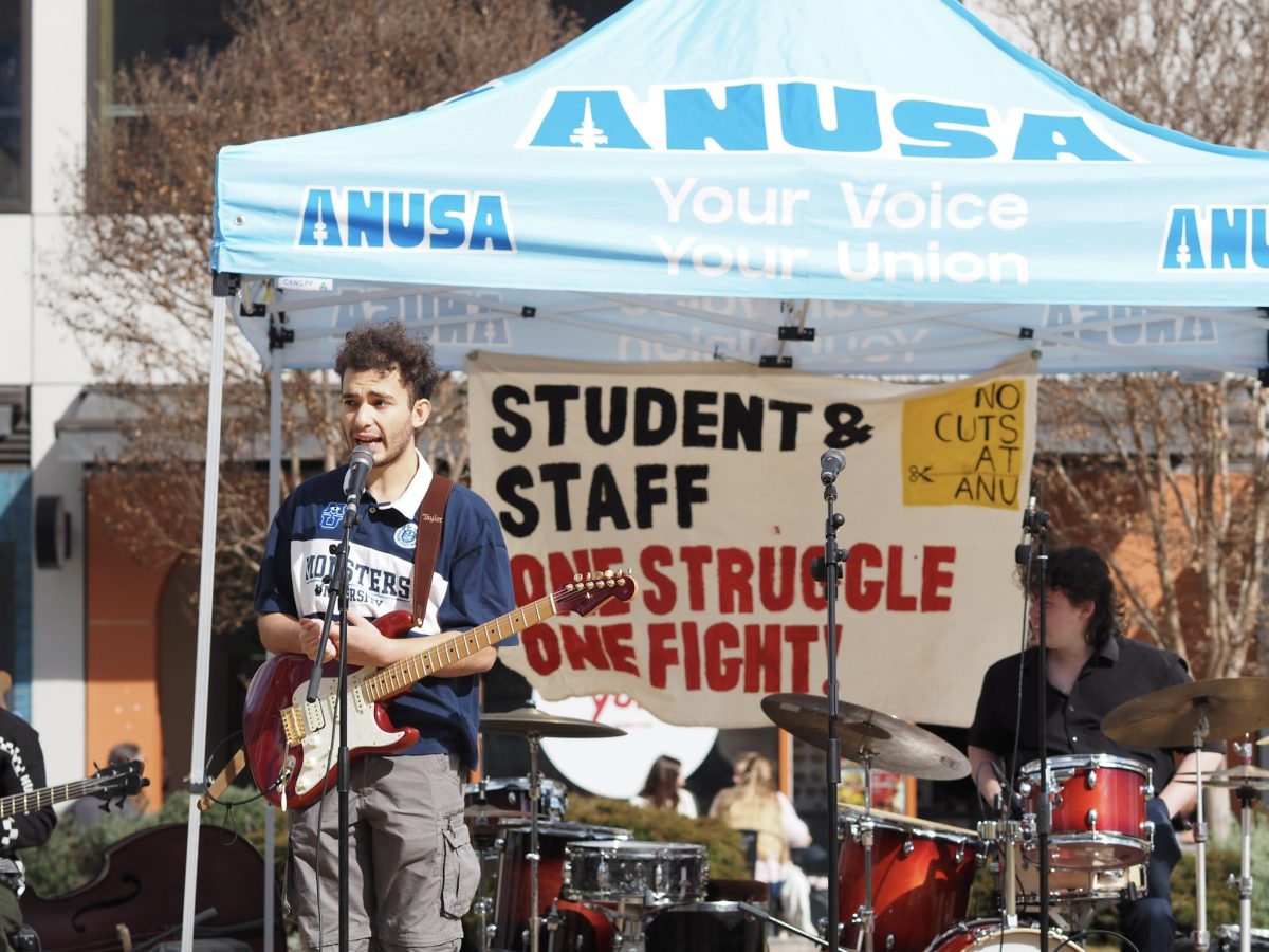 musician protester holding an electric guitar