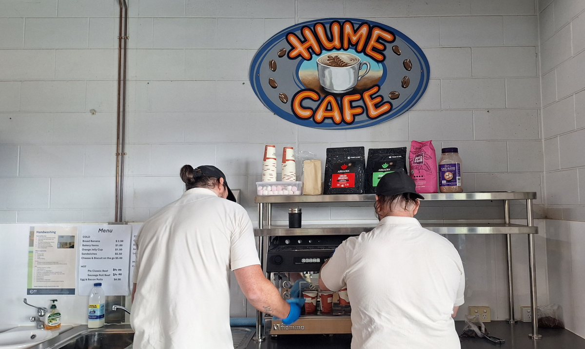 two men working at a cafe