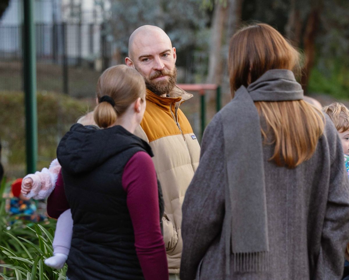 Thomas Emerson speaking with community