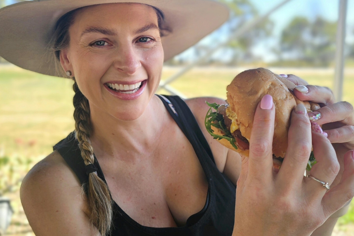 Woman holding burger