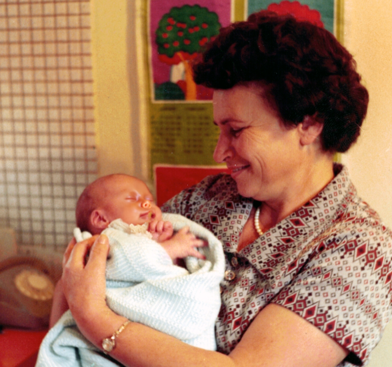 grandmother holding a baby