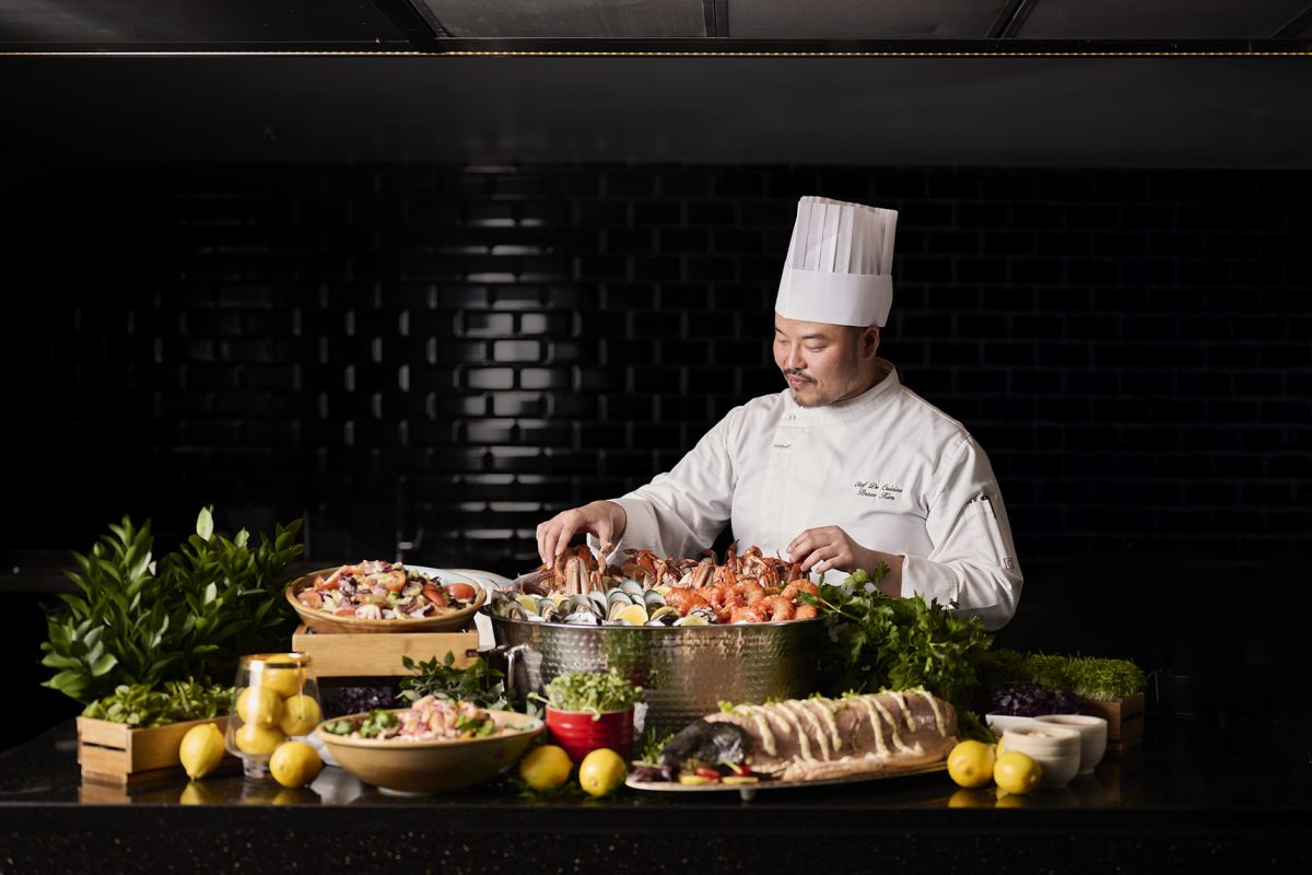Chef preparing seafood buffet at Hyatt Hotel Canberra