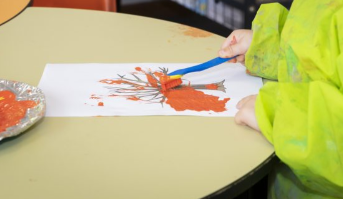 child painting a picture