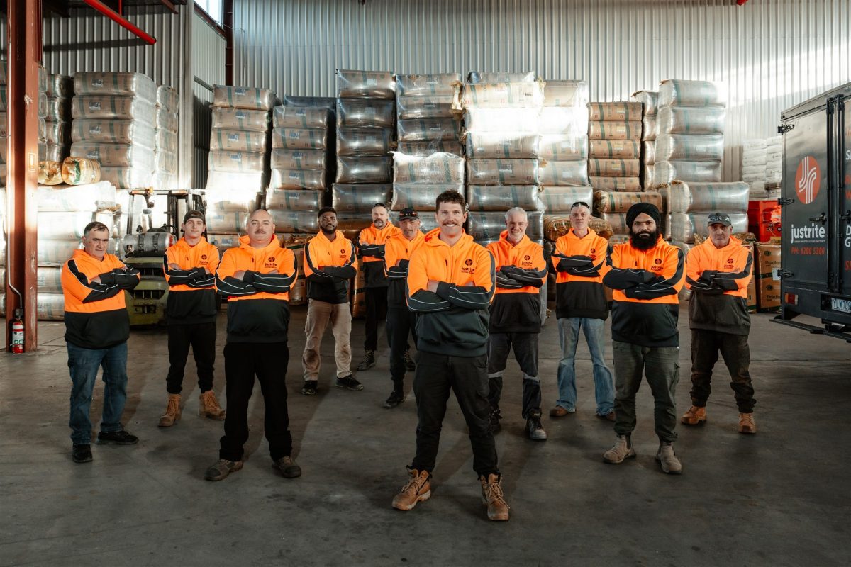 Just Rite team wearing high-vis uniforms in warehouse