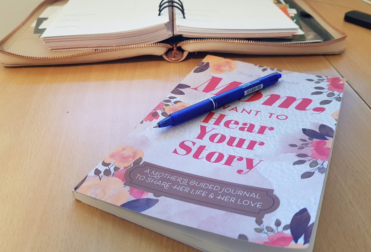 book and pen on a desk