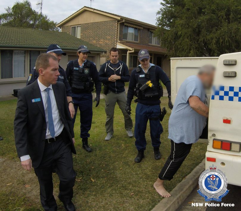 NSW police arresting a man at Surf Beach.