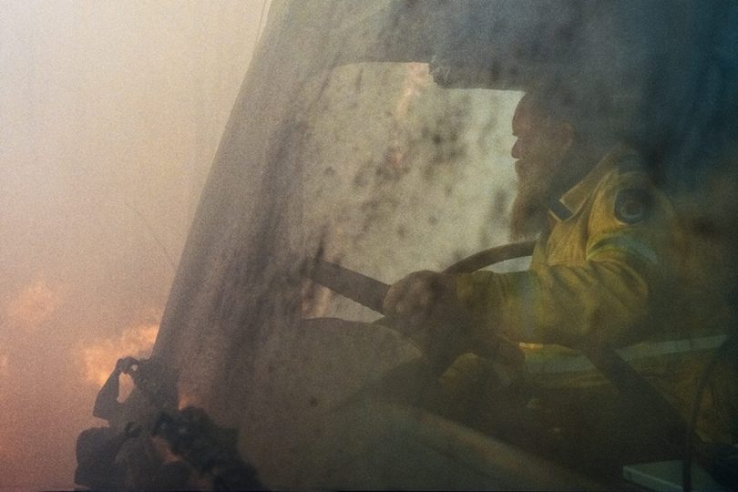 Volunteer RFS firefighter driving truck.