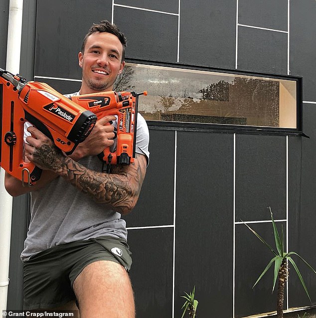Builder Grant Crapp holding power tools.