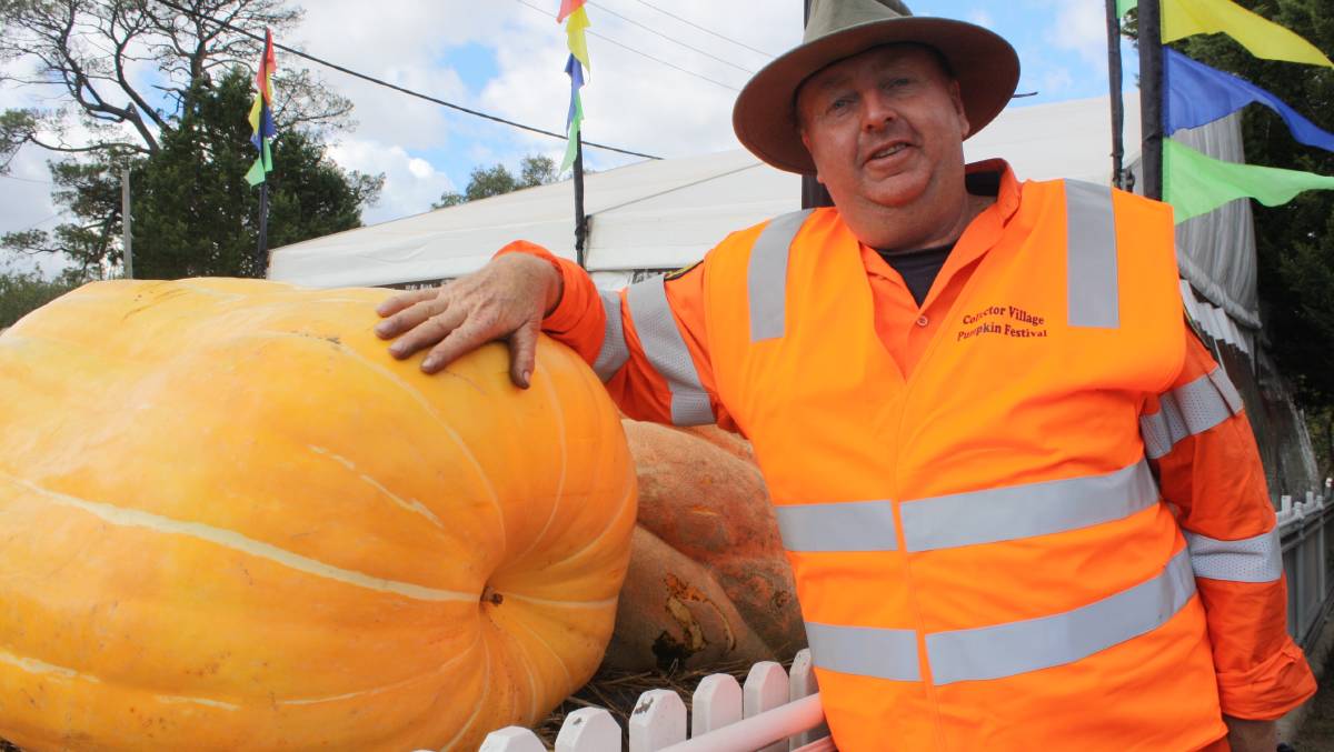 Gary Poile with a prize-winning entrant in the Collector Pumpkin Festival, an event he helped establish and ended up raising thousands of dollars for the local community. Photo: Hannah Sparks.