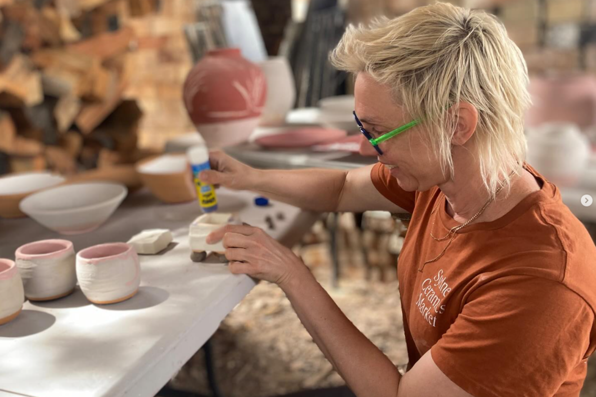 a woman doing pottery