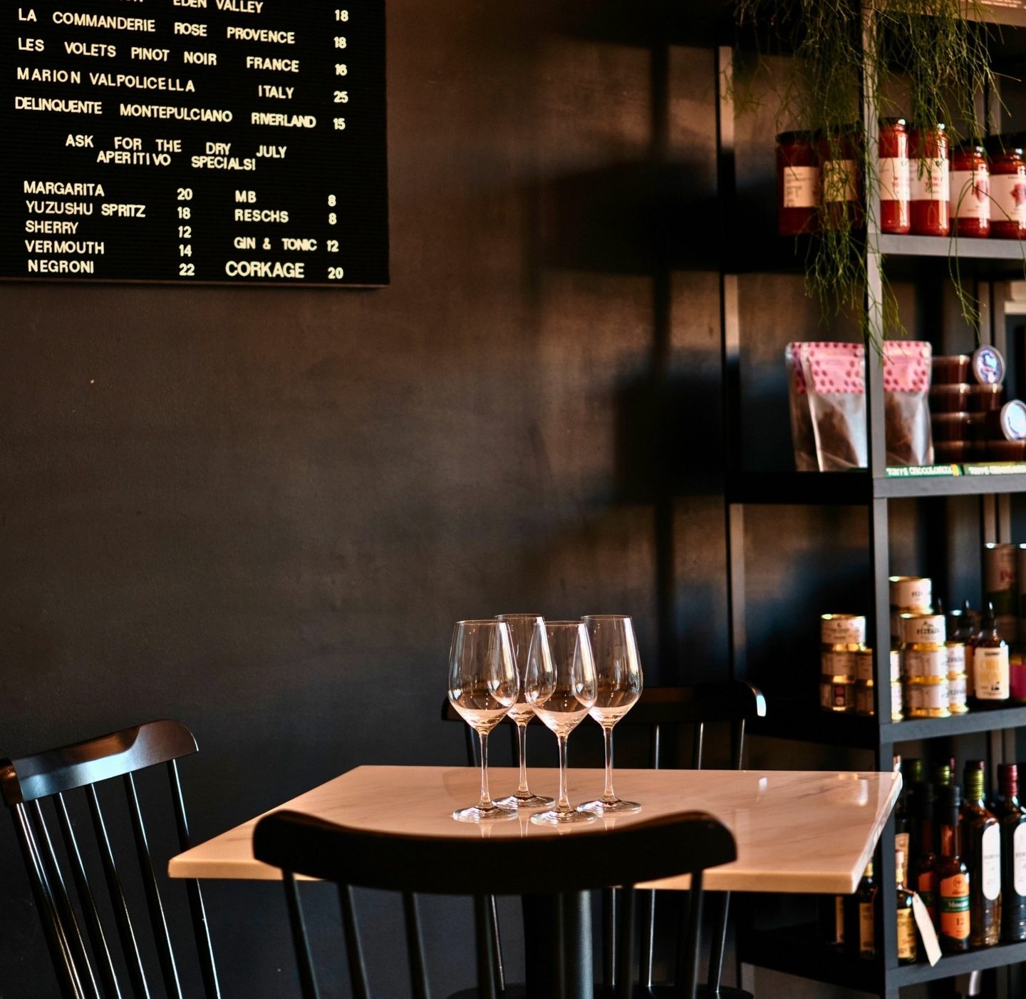 Interior of a wine bar with glasses on the table,