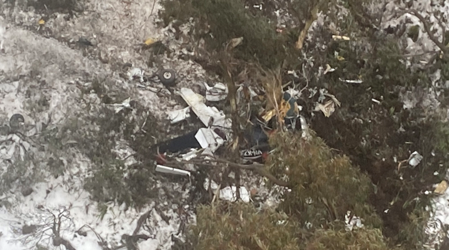 aerial view of plane wreckage on a mountainside