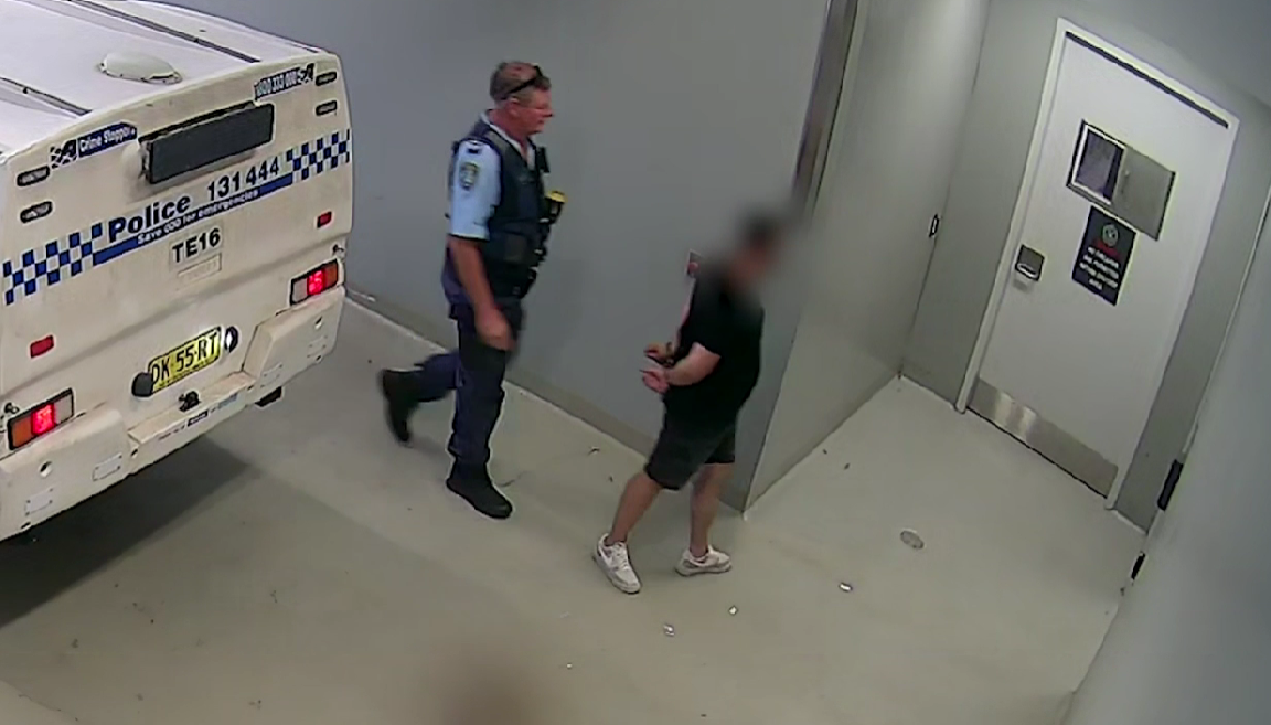 arrested man with police officer