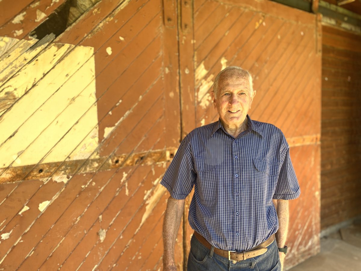Denis Lorenzi outside old doors